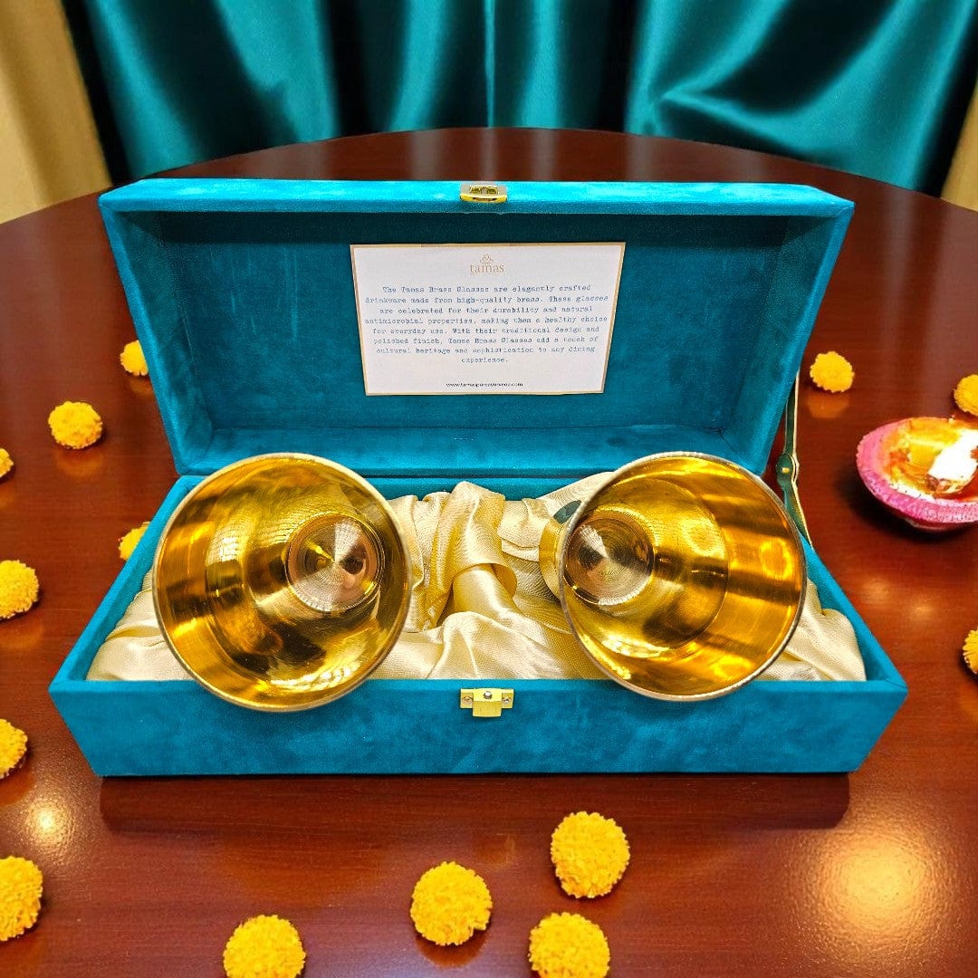 Handcrafted brass glasses in teal velvet box with golden satin lining – premium traditional Indian drinkware set by Tamas