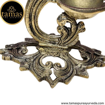 Tamas Brass Handcrafted Peacock Diya with Bell with Antique Finish (5 x 5.5 x 7.5 Inches, Golden)
